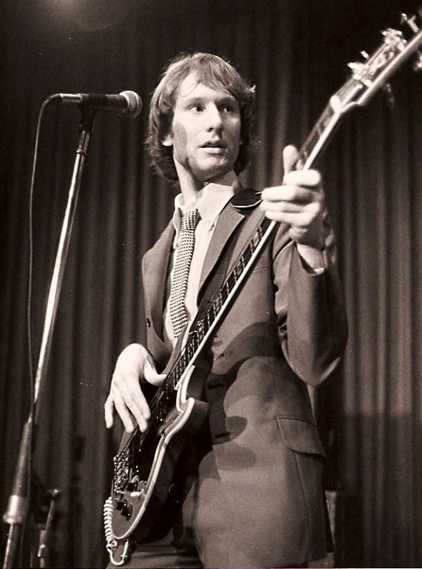 The Pleasers bassist performing